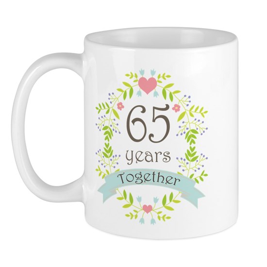 White mug with pretty floral design that reads 65 years together