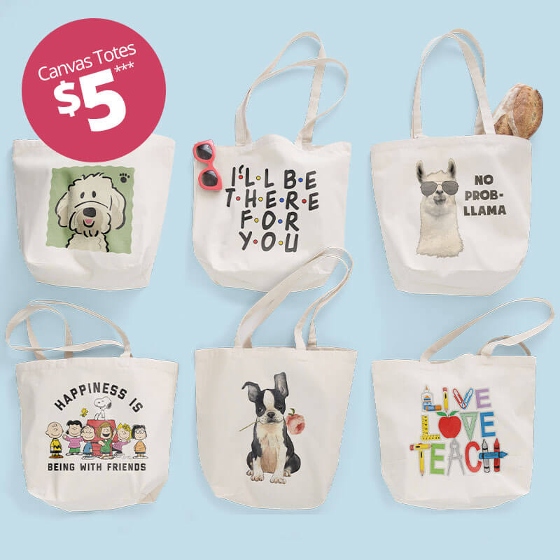 Group of 6 canvas tote bags with various custom printed designs.