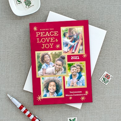Custom designed greeting card with family photos and stylized text that reads: Peace, Love, Joy, 2021 and family name.