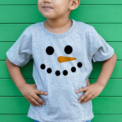 Little boy wearing a custom design t-shirt with a snowman face print.