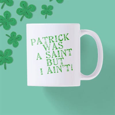 A standard CafePress mug with a text design reading - Patrick was a saint but I aint.