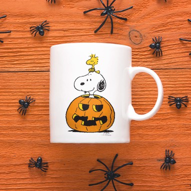 Official licensed PEANUTS® Snoopy Halloween design with Snoopy and Woodstock in a pumpkin custom printed on a 11oz mug.