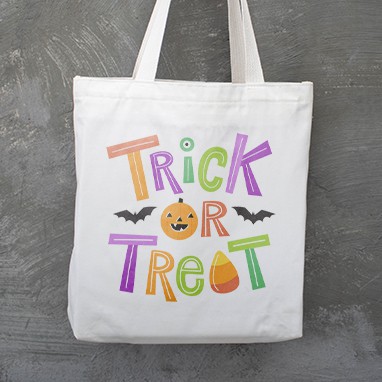 Custom design tote bag with stylized trick or treat text design.