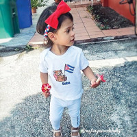 Little girl representing her Cuban pride with a custom Cuba design on a toddler shirt.