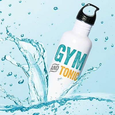 Custom printed water bottle splashing into water. Stylized text design that reads: Gym and Tonic.