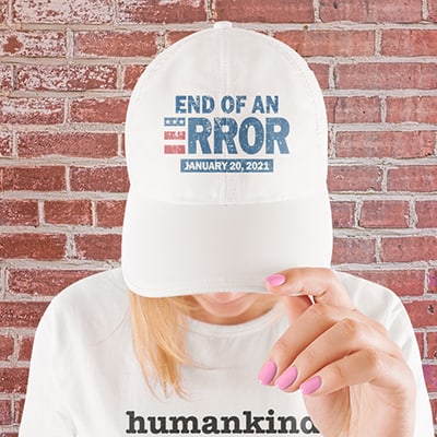 Woman in a white baseball cap with stylized text custom design that reads: End of an Error. January 20, 2021.