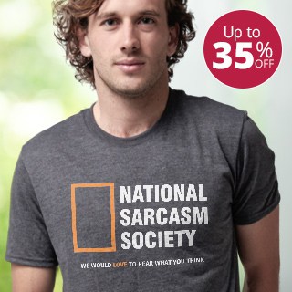 Young man wearing a custom designed and printed tri-blend t-shirt with stylized logo design that reads: National Sarcasm Society.