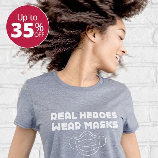Young woman wearing a custom printed tri-blend t-shirt with stylized text design that reads: Real Heroes Wear Masks.
