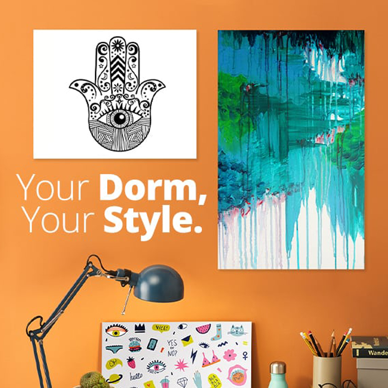 Your Dorm, Your Style. Dorm room desk area with cool posters hanging on the wall.