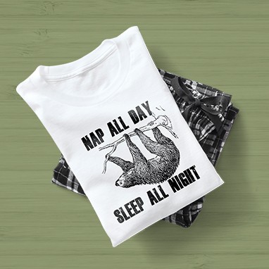 Pajama set with funny sloth design on the t-shirt which reads: Nap All Day, Sleep All Night.