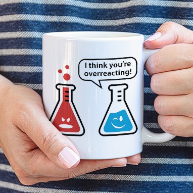 Coffee mug with funny custom design showing beaker illustration and text that reads: I Think You're Overreacting.