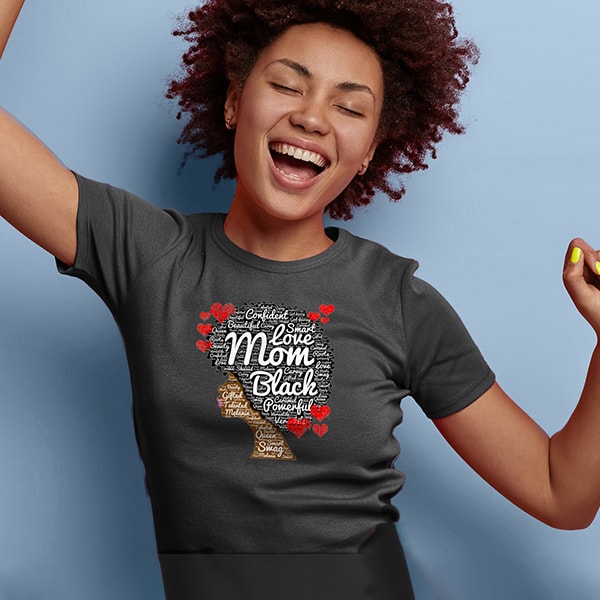African American Female wearing a gray t-shirt with an illustration celebrating being a mother of color.
