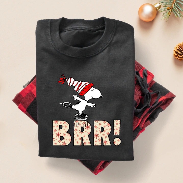 Snoopy in Christmas Peanuts pajamas.