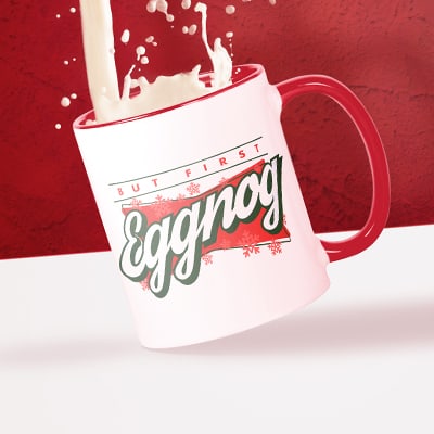 CafePress' new red handle standard mug with a stylized text design reading: Eggnog - having eggnog poured into it.