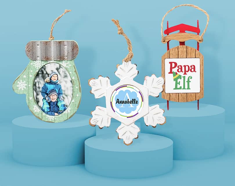 3 custom designed CafePress ornaments in the shape of a mitten, snowflake, and old school sled. The perfect gift to celebrate the holidays.