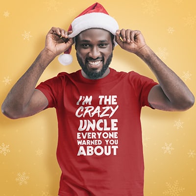 African American male wearing a customized t-shirt with a design reading: I'm the crazy uncle everyone warned you about.