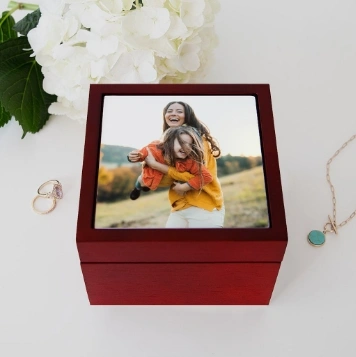 Keepsake box with a custom design of mother and child playing.
