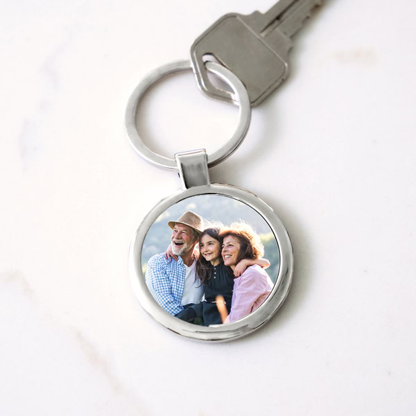 Custom printed keychain with a personalized photo design.