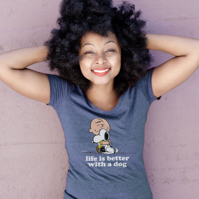 Young woman wearing a purple t-shirt with a custom design.