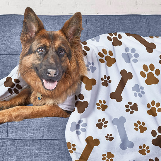 Gift Ideas for People Who Sew, Knit, Needlepoint or Cross Stitch. Image of a tote bag stuffed with flowers and a custom design printed on the front that reads: Weekend forecast, sewing with a chance of wine.