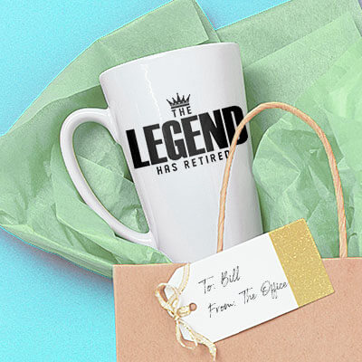 Fun Gift Ideas for Retirees. Mugs, T-Shirts, Drinkware, Apparel, Hats, Accesssories to mark that special retirement occasion. Image of a latte mug surrounded by gift wrapping with a design that reads: The Legend Has Retired.