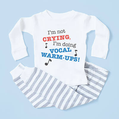 Special gift ideas for the new baby and baby momma and daddy. Unique designs printed on baby onesies, baby blankets, baby hats, t-shirts, blankets, pillows and more. Image of baby pajamas with gray striped pants and long sleeve shirt that has a design that reads: I'm not crying, I'm doing vocal warm-ups.