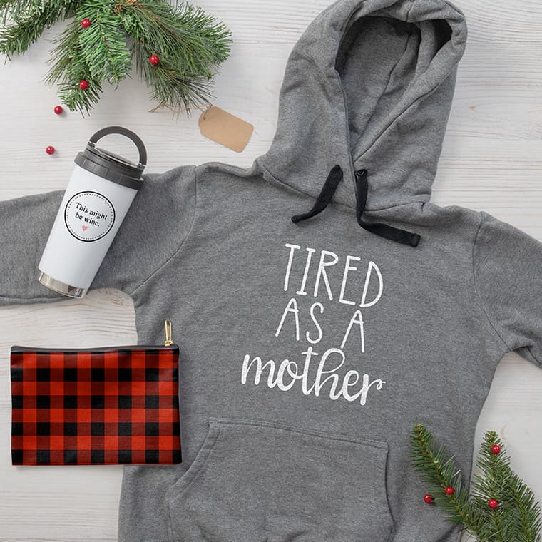 Women's gift ideas featuring grey hoodie with paw print heart design, travel mug with This Might Be Wine design, and makeup bag with sandals pattern design.