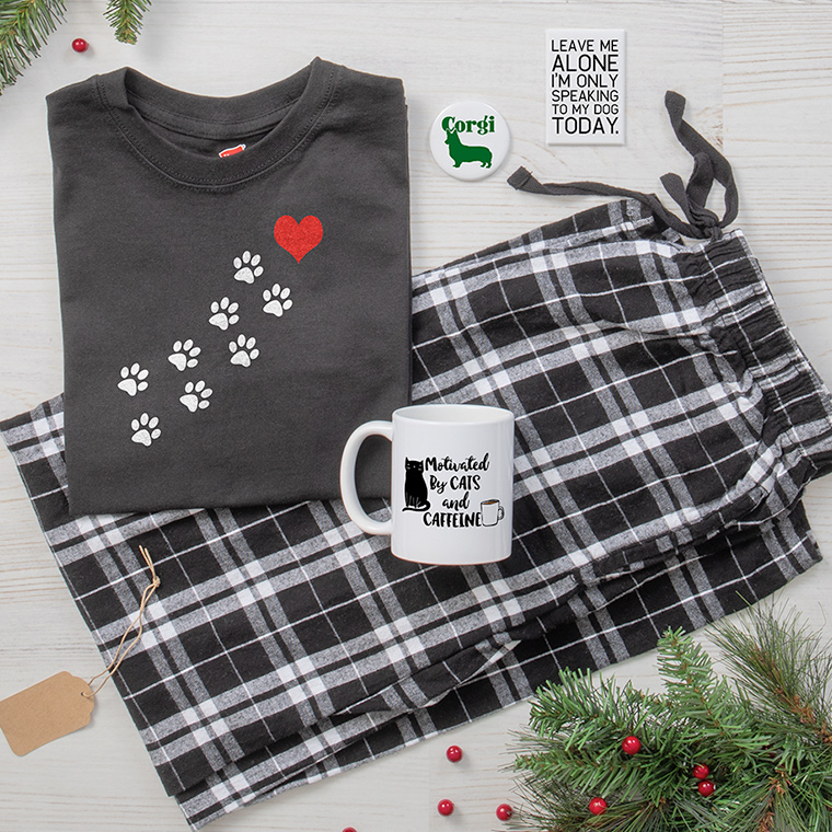 Pet Lover gift ideas featuring paw print pajamas, mug with Cats and Caffeine design, and dog magnets.
