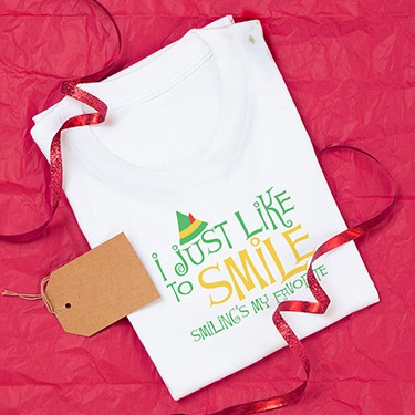 Custom printed funny Christmas holiday t-shirt with Elf movie design that reads: I just like to smilw. Smiling's my favorite.